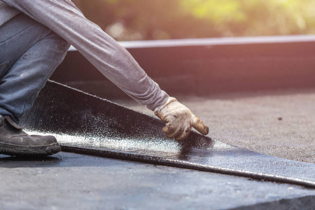 Professional Waterproofing technician working in Guntersville, AL
